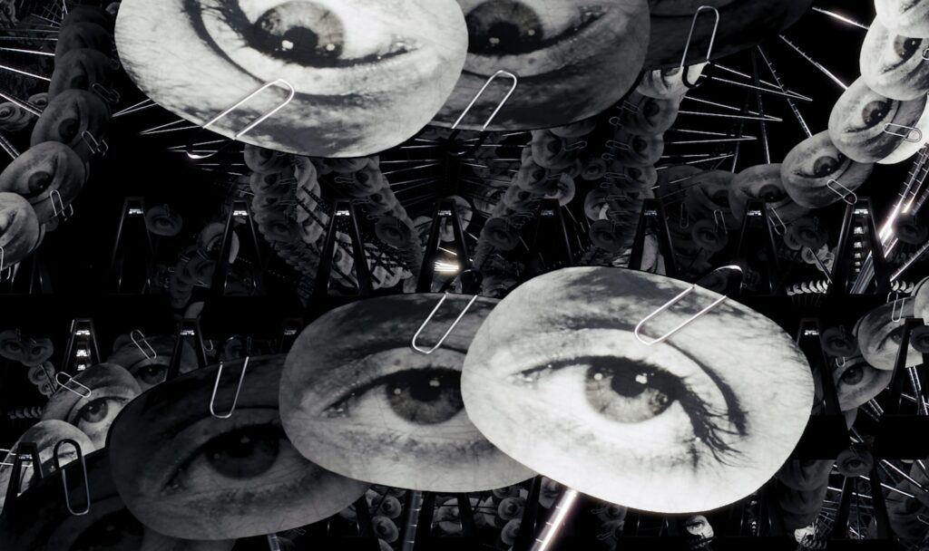 Still from Marco Brambilla's Object to be Destroyed: 66 Times: multiplied black-and-white metronomes with photographic eyes clipped to their pendulums.